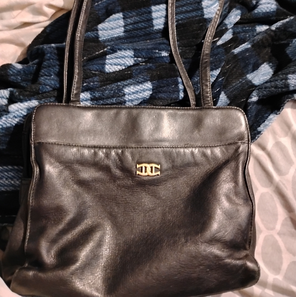 I am sell Etienne aigner bag.cause need help paying with power bill ASAP